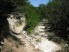 The trail runs along this dry creekbed before you cross the bridge